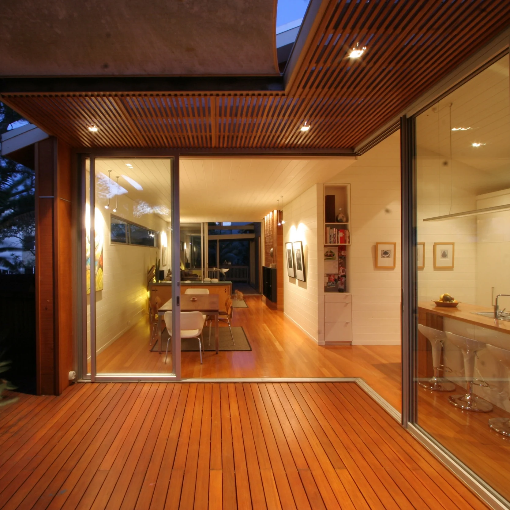 MANLY 01 ALTERATION + ADDITION A large block was subdivided with a new residence built, leaving this small timber cottage to be transformed into a contemporary beach house. Living spaces were opened up and flow through to decks and garden, giving a spacious feel to a compact site. Extensive use of timber gives warmth to this relaxed family home. BUILD: 157sqm / COMPLETED: DEC 03 / BUILDER: Ben Donald & Greg Brown / PHOTOS: Sumant Tanna