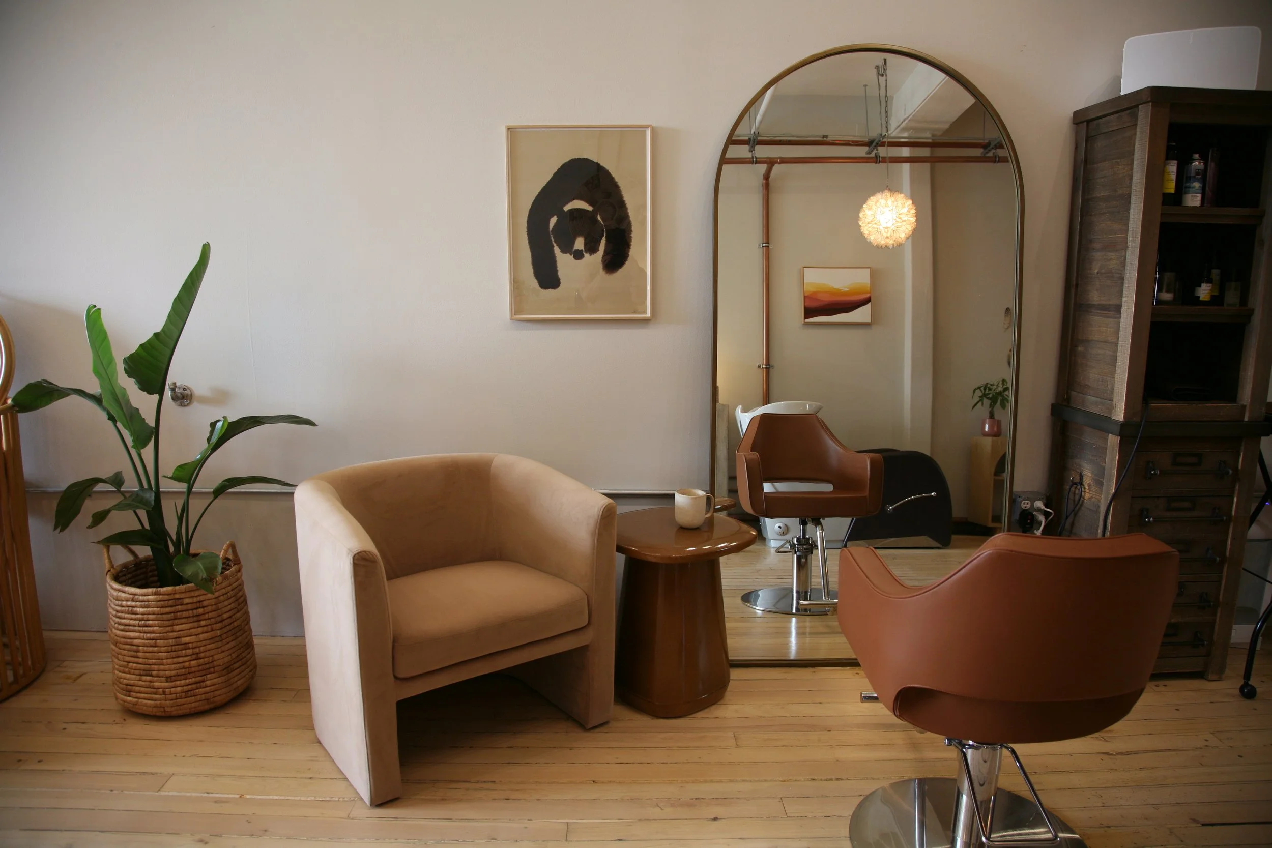  Here is one of my most important areas where I work with clients to achieve their hair goals. You also see an extra chair—mostly for me to sit!—because connecting with my clients is my favorite part of the job. 