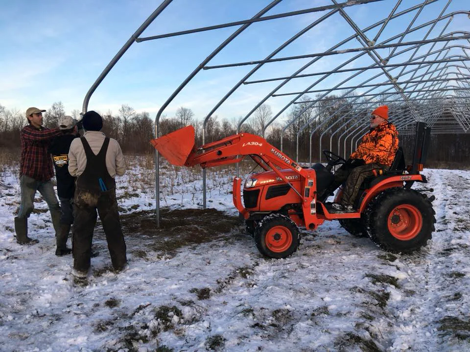 Grandpa Gary and his tractor, and several friends helped with our big high tunnel project in December.