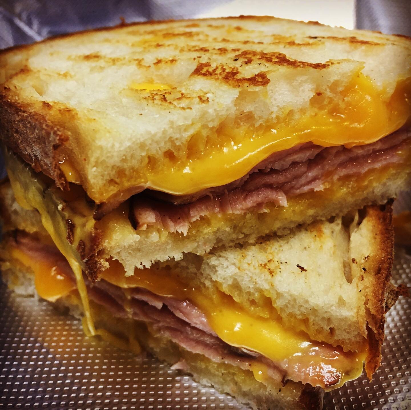 Nothing says comfort food more than our ooey-gooey Grilled Ham &amp; Cheese Sandwich!  #comfortfood #sandwich #sandwiches #lunch #lunchtime #cheese #ham #hamandcheese #sourdough #localbusiness #local #sandiego #sandiegorestaurants #sandiegofoodscene