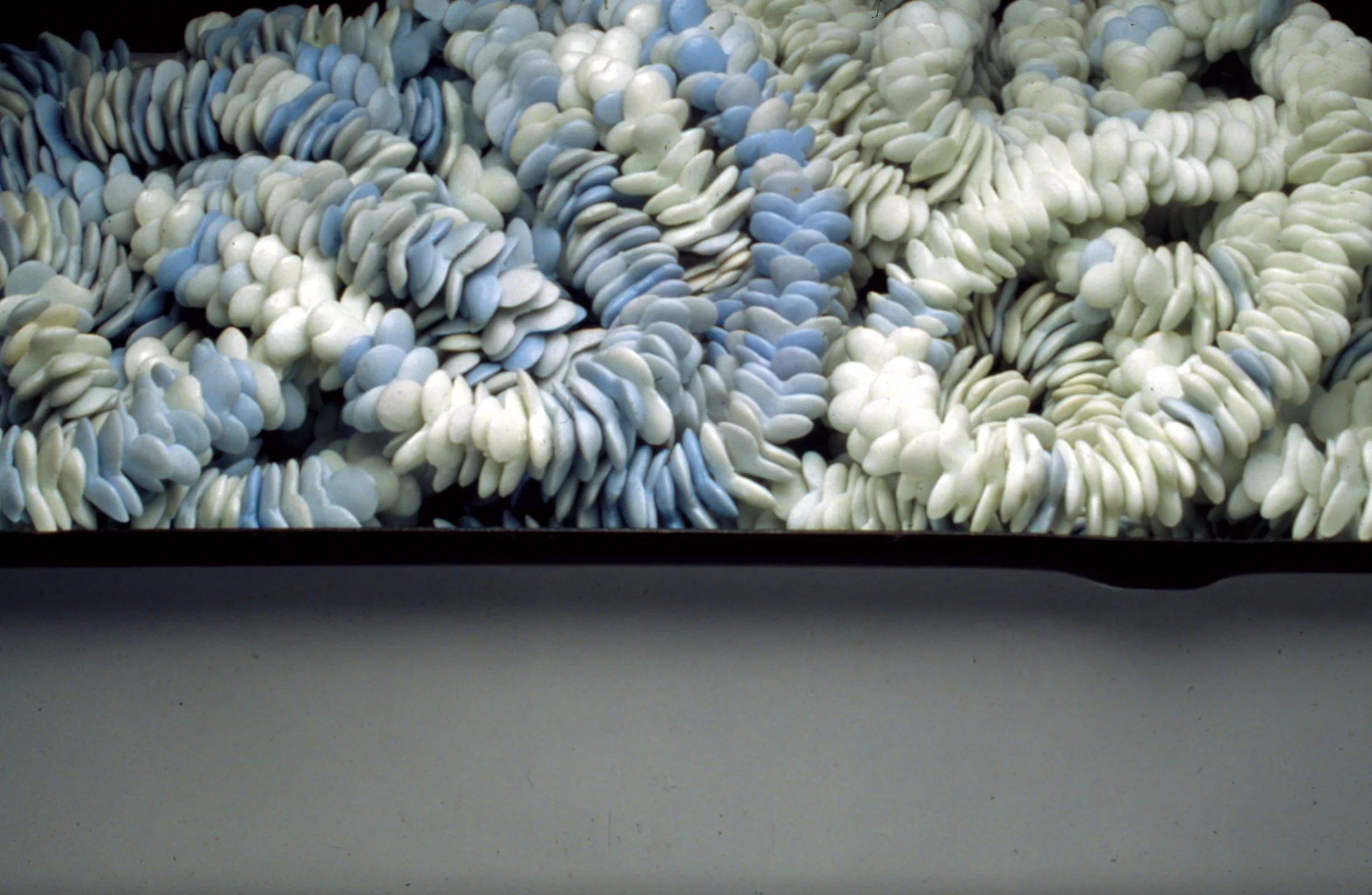 detail of <i>frail hope, internal distance: object II</i>, porcelain, metal drawer, c/10 red. and ox. fired, h. 6" x w. 15" x d. 11", 2002