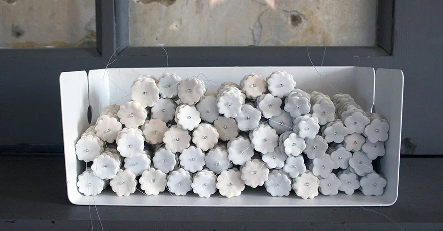 <i>frail hope, internal distance: object XII</i>, porcelain, mono filament, metal shelf, h. 4" x w. 10" x d. 5" 2013