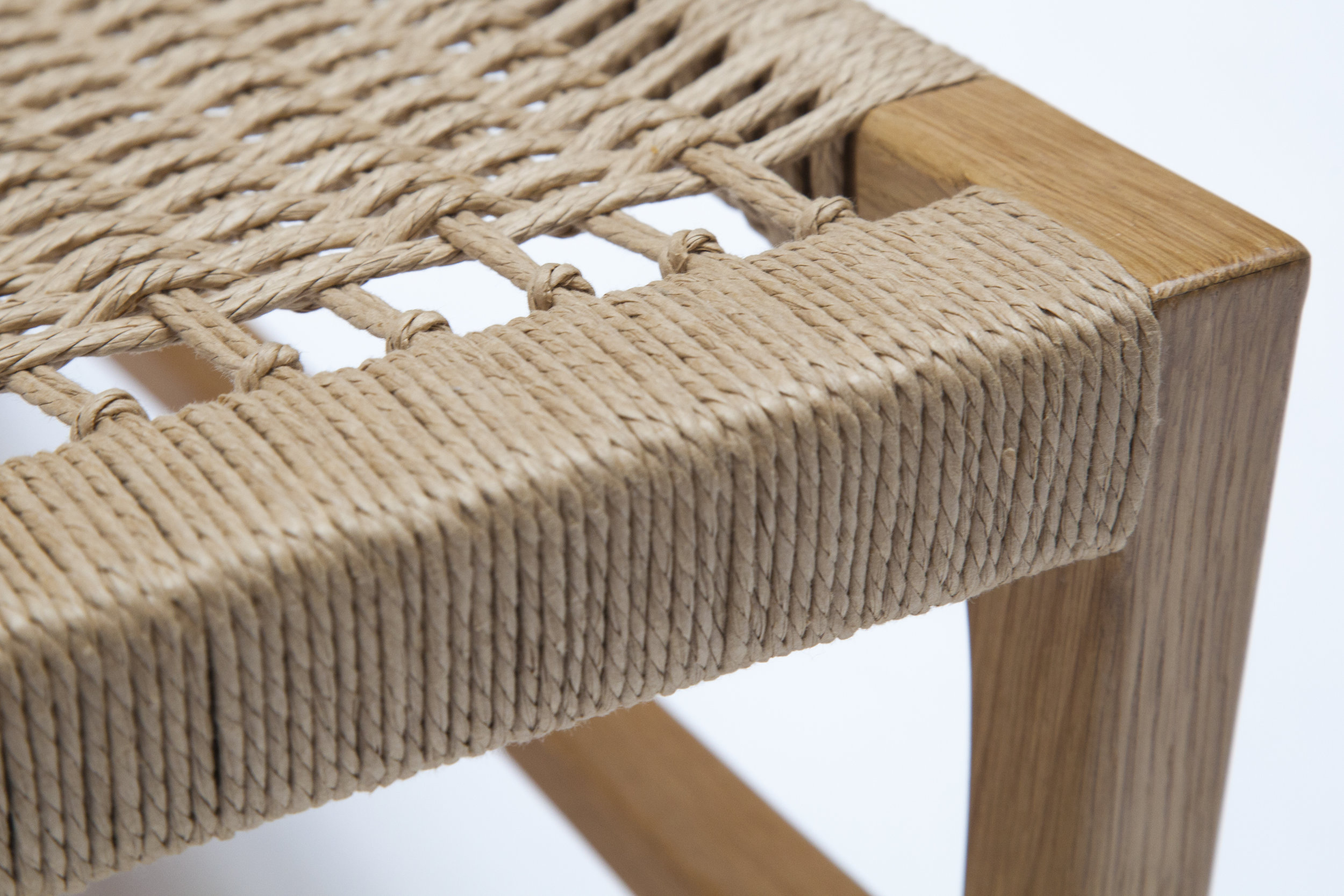 Close-up showing the tight weave and craftsmanship of the seat edge.
