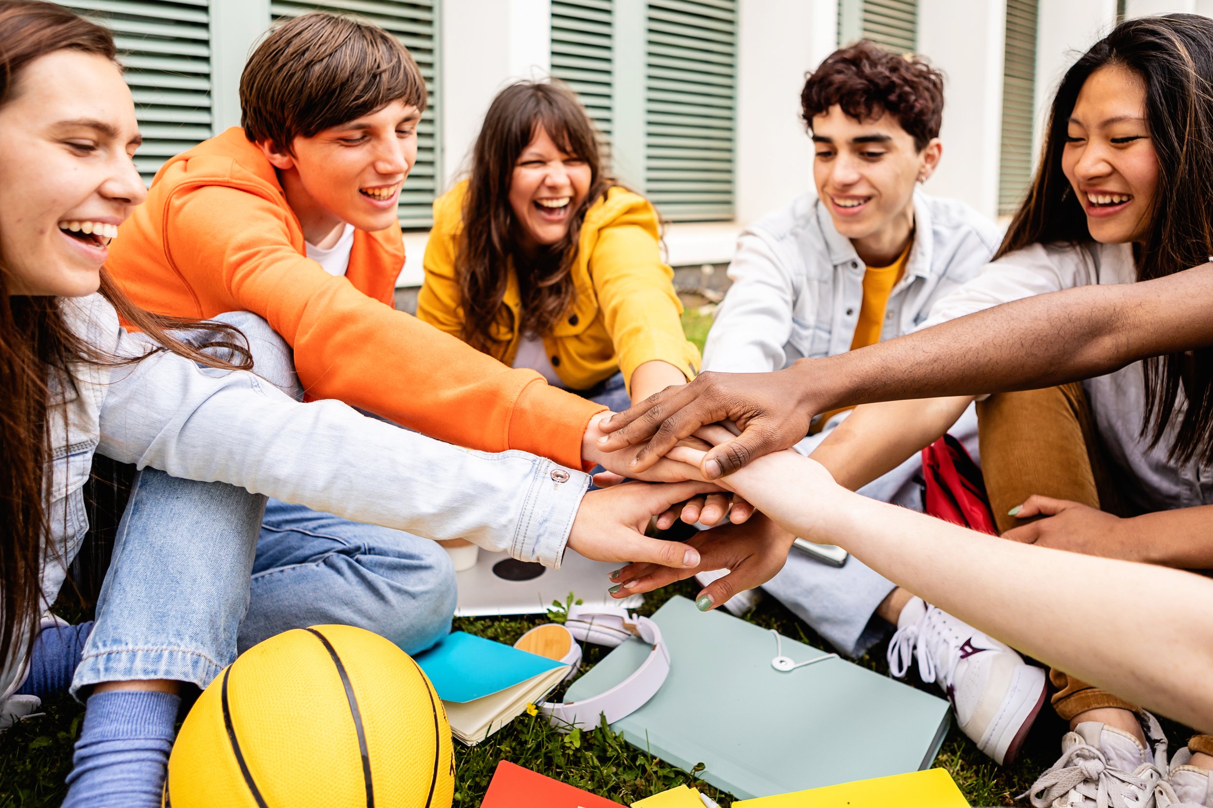 multiracial-group-of-young-student-people-stacking-2026-01-09-00-27-00-utc.jpg