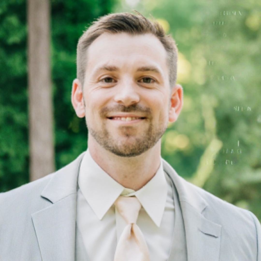 Nick Robison, PayBright Agent wearing a tan suit
