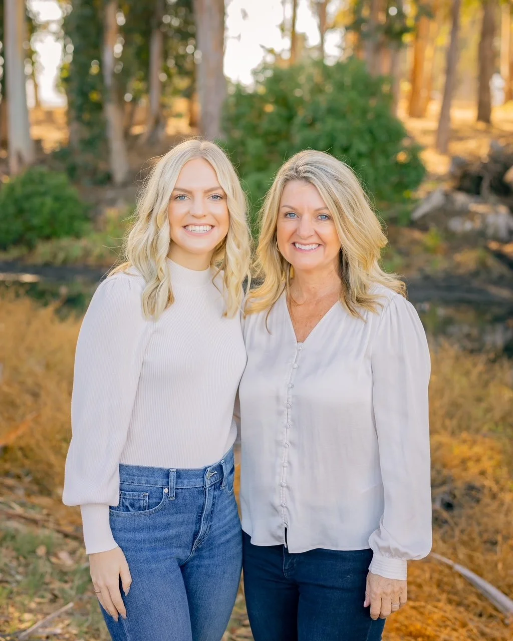 Two PayBright Agents in white blouses with a fall background