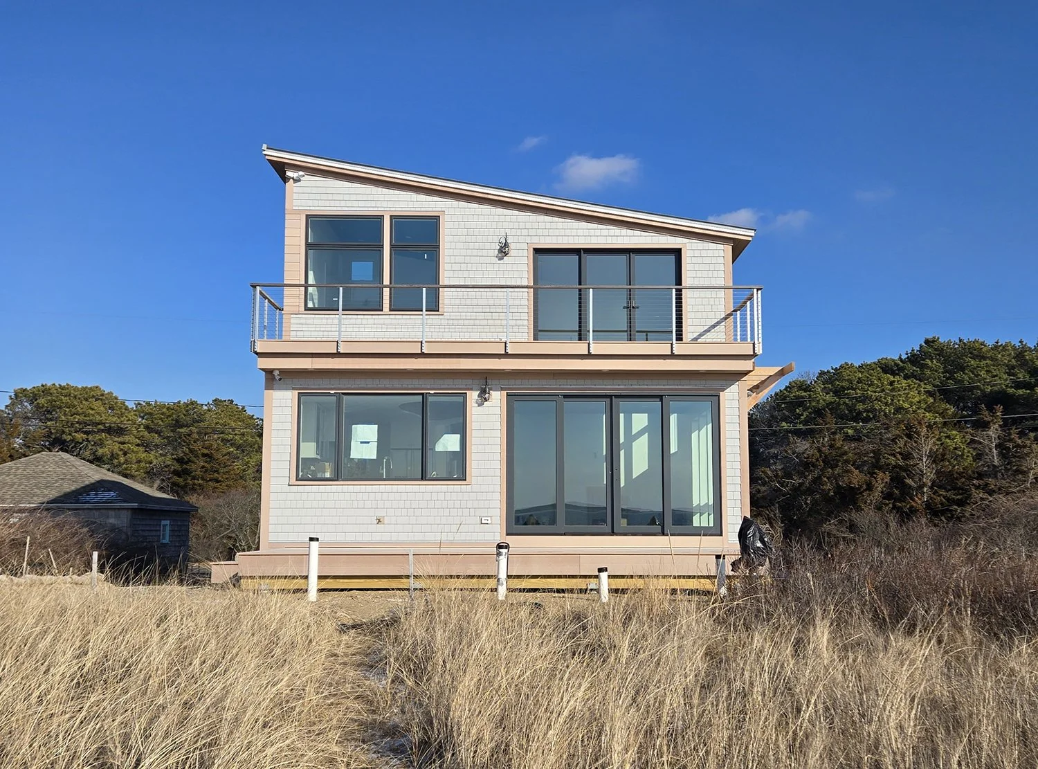 Wellfleet-near-Net-Zero-exterior-water-1-a3-architects.jpg