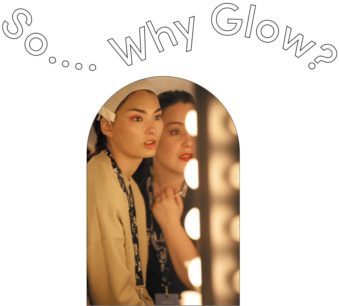 Backstage fashion makeup session in Barcelona with model in front of mirror lights