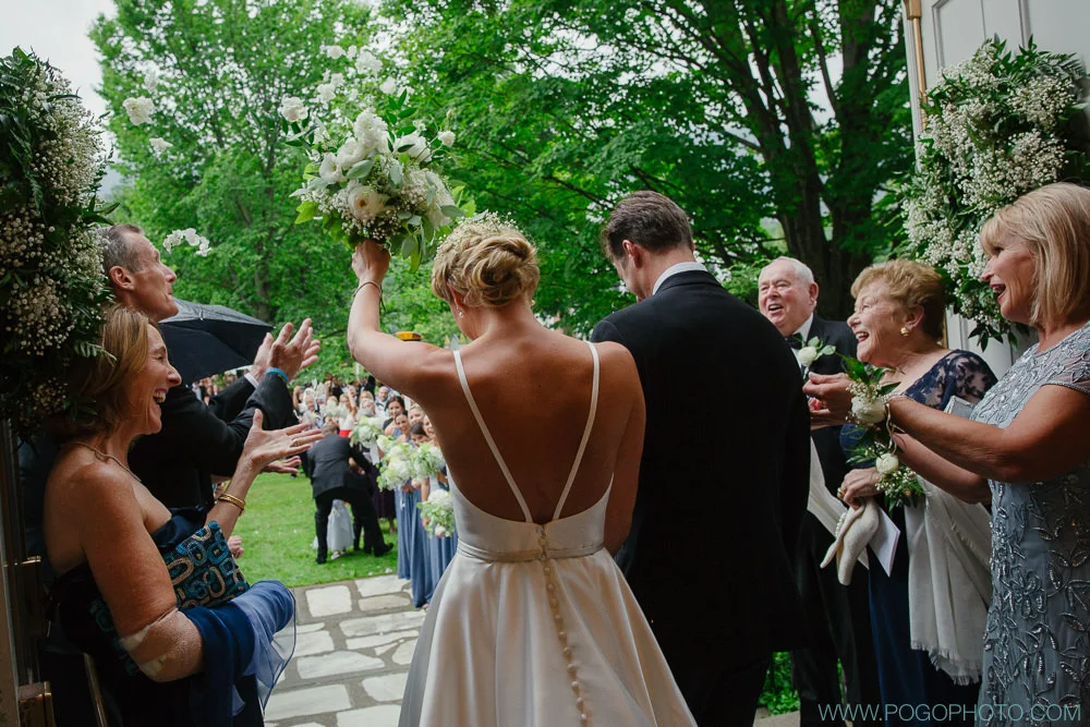 Notice a change here? In the time it took to get guests out of the church and armed with flowers for the send off we were able to get Hayley to a back room where her incredible stylists removed her veil and gave her a complete hair transformation. It was tight but we did it!