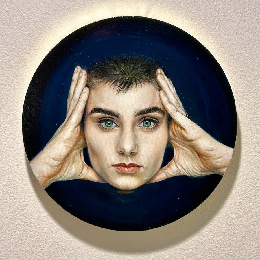 An oil painting of Sinéad O'Connor from "Nothing Compares 2 U".