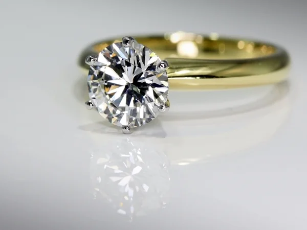  Timeless classic, 1.50 carat round brilliant cut diamond claw set in platinum with 18k yellow gold band. Hand made by Manjian Design Works. 
