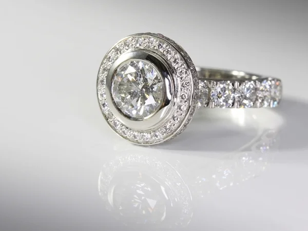  Bespoke diamond halo engagement ring in platinum. Hand made by Manjian Design Works. 