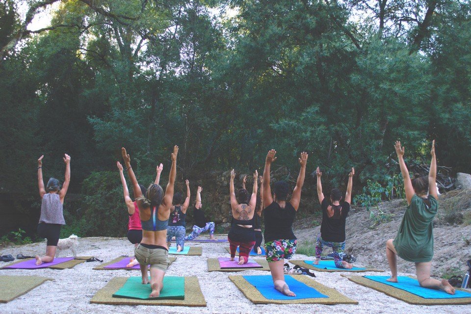 Yoga by the private river beach