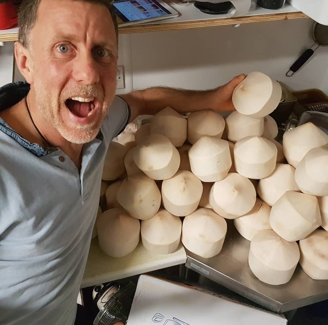 Garry with his supply of young Thai coconuts