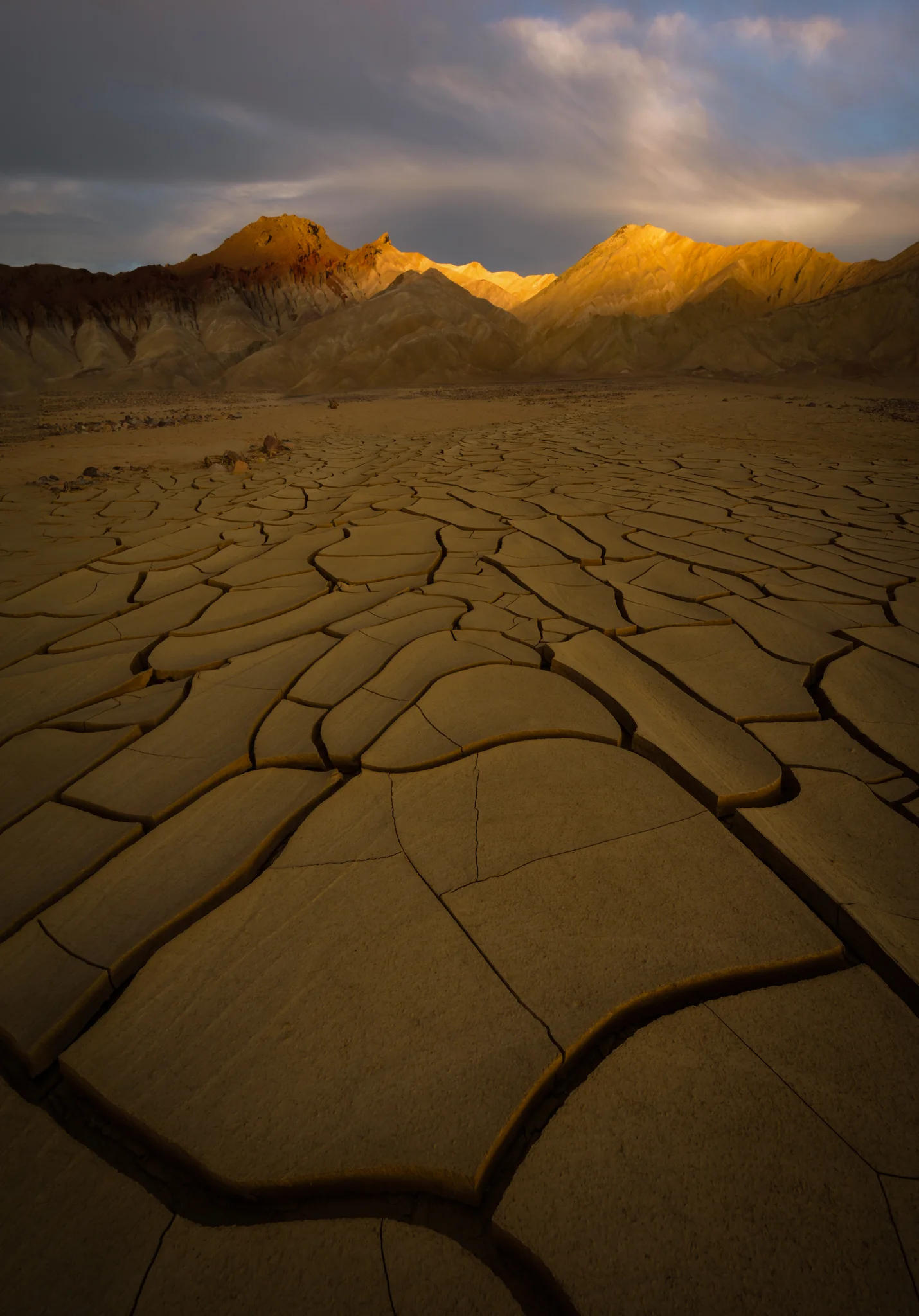 Indescribable mud cracks point to sunset’s last light.