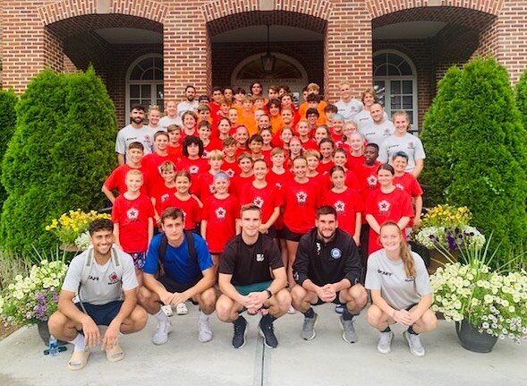 Hartford Athletic Pro goalkeepers Yannick Oetil, Sam Howard and Sebby Pliszka take a group photo before they take the SGA campers for training.