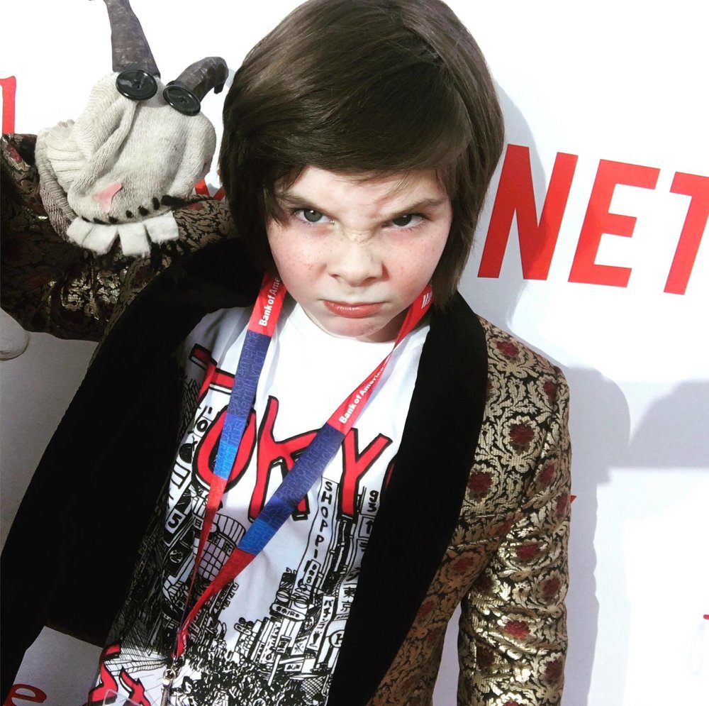 on the red carpet for "little evil" with Reeroy, the goat puppet
