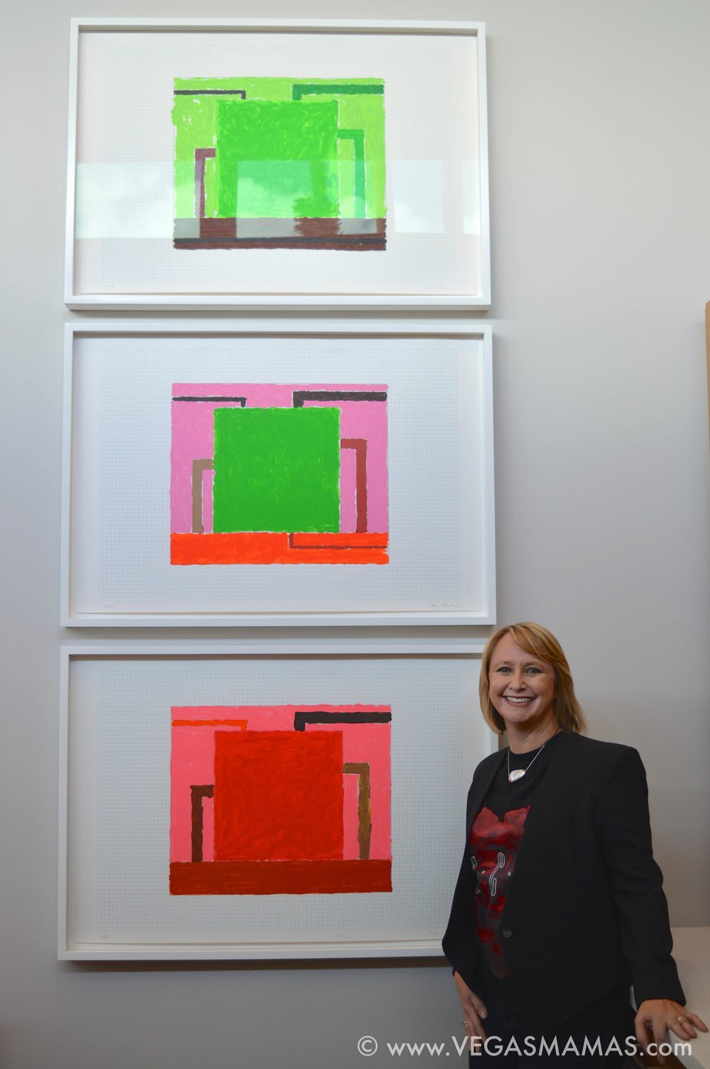 Michele in her kitchen with Peter Halley's triptych