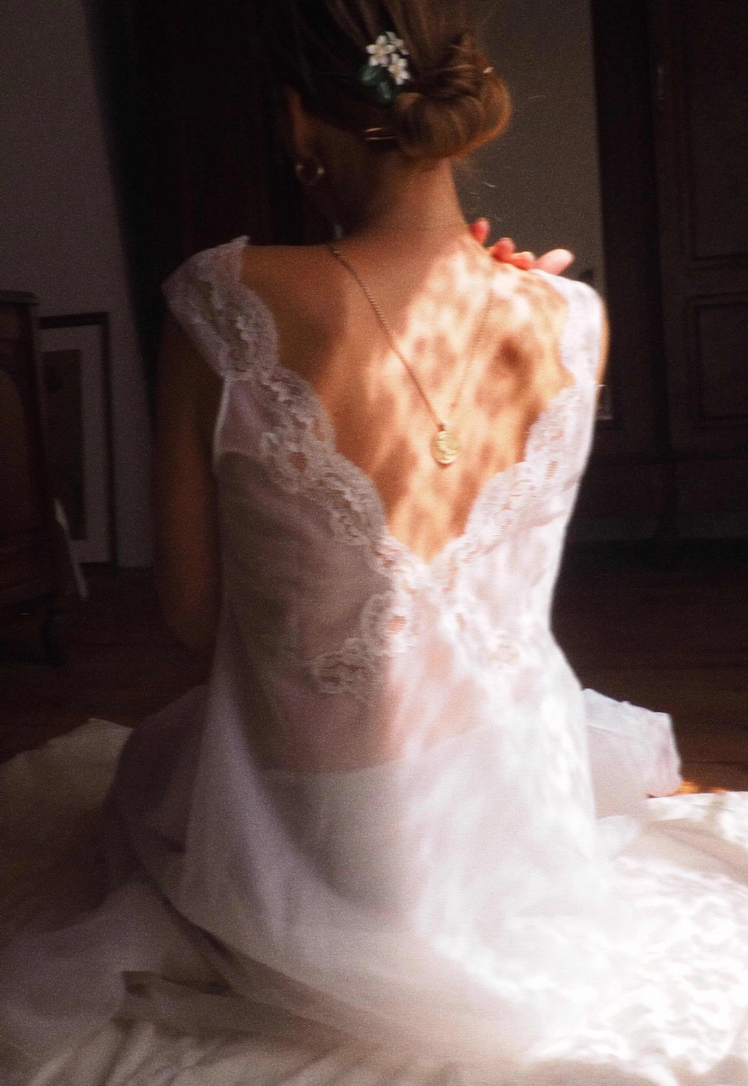 Model wearing a white lace dress