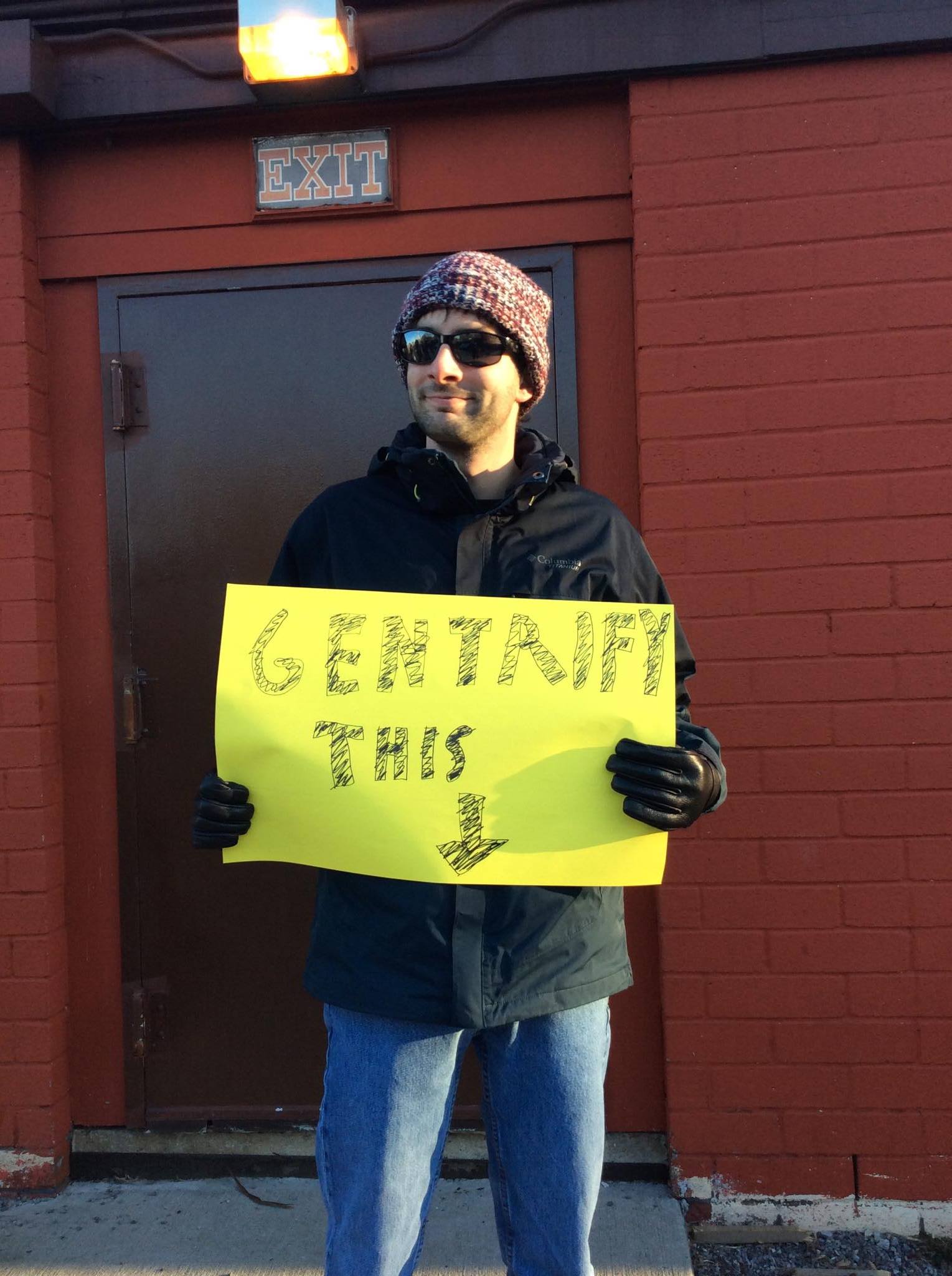 Restaurant Patron Dan Clerkin protests the gentrification- luxury condos being built in place of local businesses while there are many homeless in Coram. 