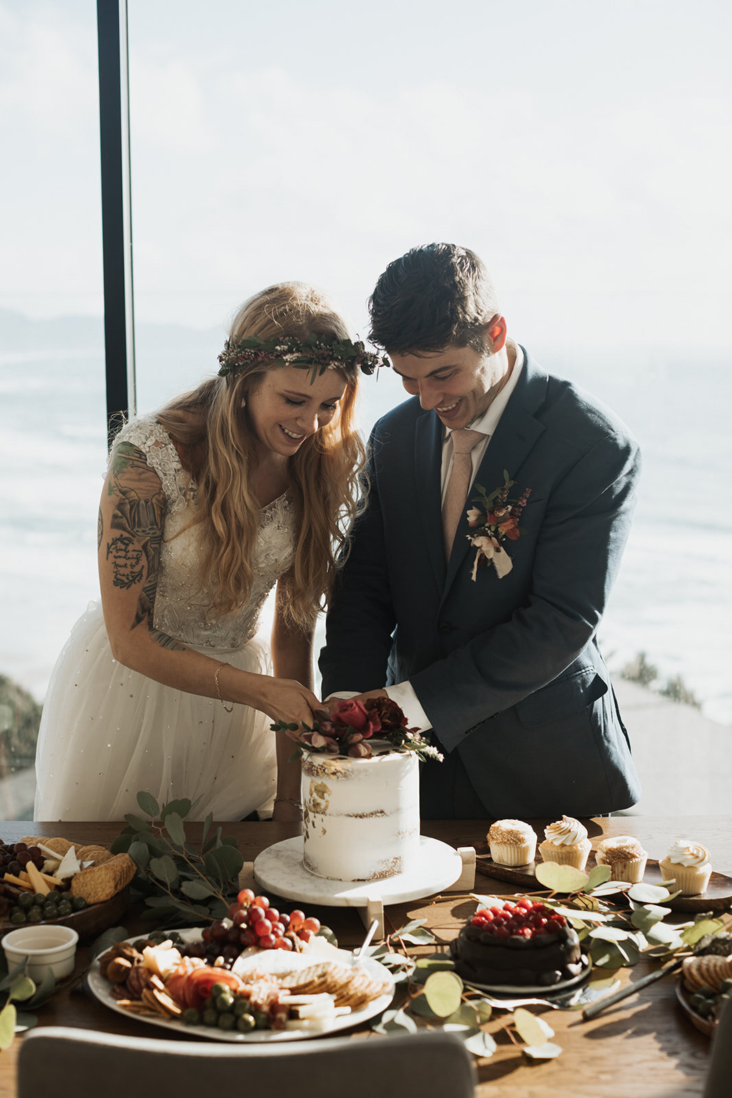Bride and groom cutting their customized cake by Promise Mountain