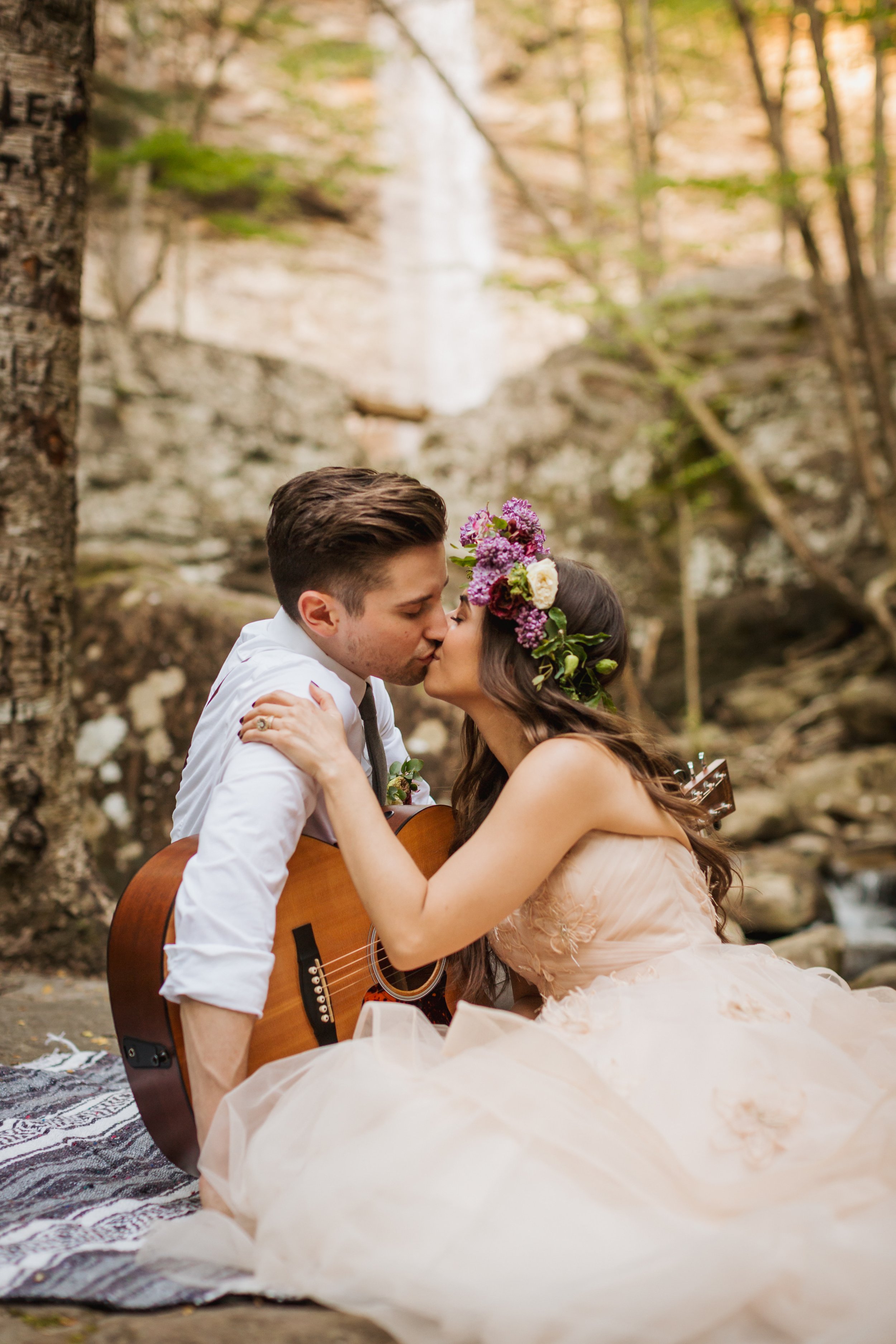 Couple sharing a kiss at their outdoor, nature-inspired elopement shoot with Promise Mountain