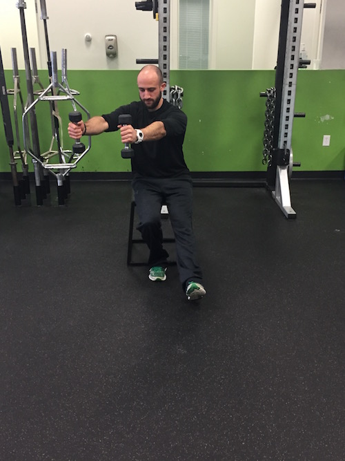 Reaching DB's over your working leg when lowering down still serves as a counterbalance, but also shift your center of mass more over you base of support and will allow you to feel more stable.