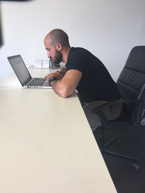 Over rounding your upper back and reaching your head out towards your computer can lead to your pecs and neck feeling tight