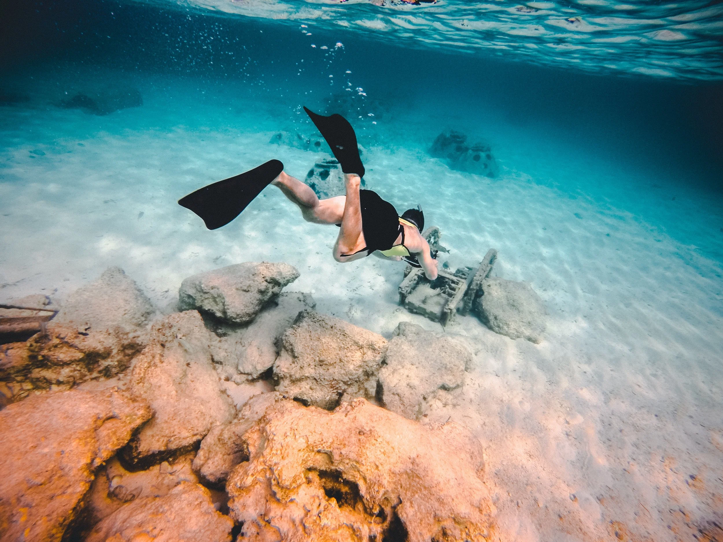 A diver exploring the crystal-clear waters of the Bahamas.