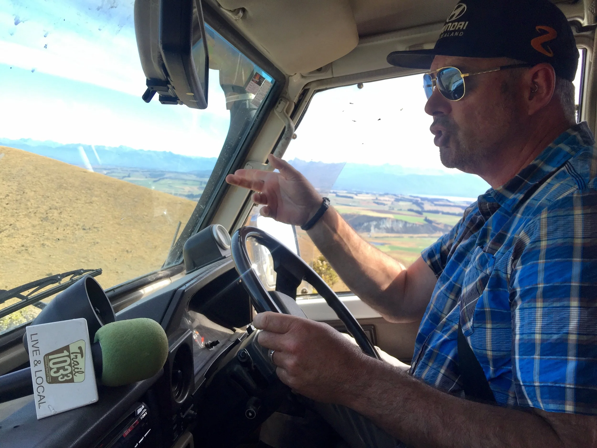 Interviewing Rosco Gaudin in his heavily modified Land Cruiser traveling down a 4x4 track on Mount Prospect above Te Anau overlooking Fiordland National Park on New Zealand's South Island's West Coast. Rosco races his custom built 4x4 trucks in enduro races.