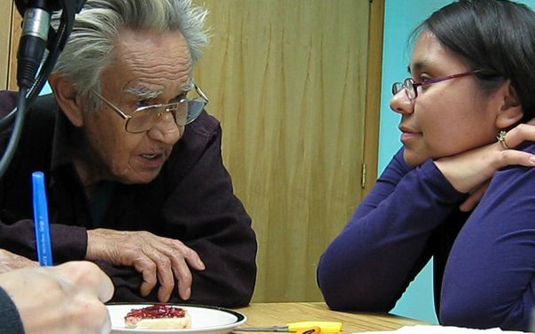 Kristy and Ts'inni Stephen working together closely to translate her personal story into the Haida language.