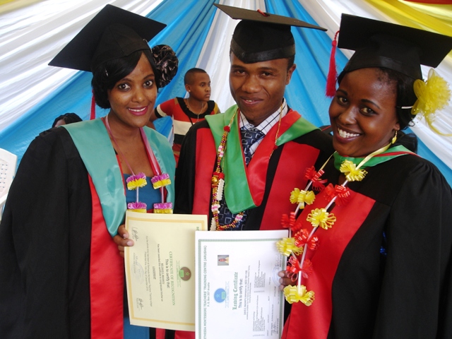 Former Umoja students David Mahanyu, Anneth Joram and Theofrida Innocent are shown celebrating their graduation from Teacher Training College. They completed their studies at Bethesda Teachers Training College and have been awarded a Diploma in Teaching. 