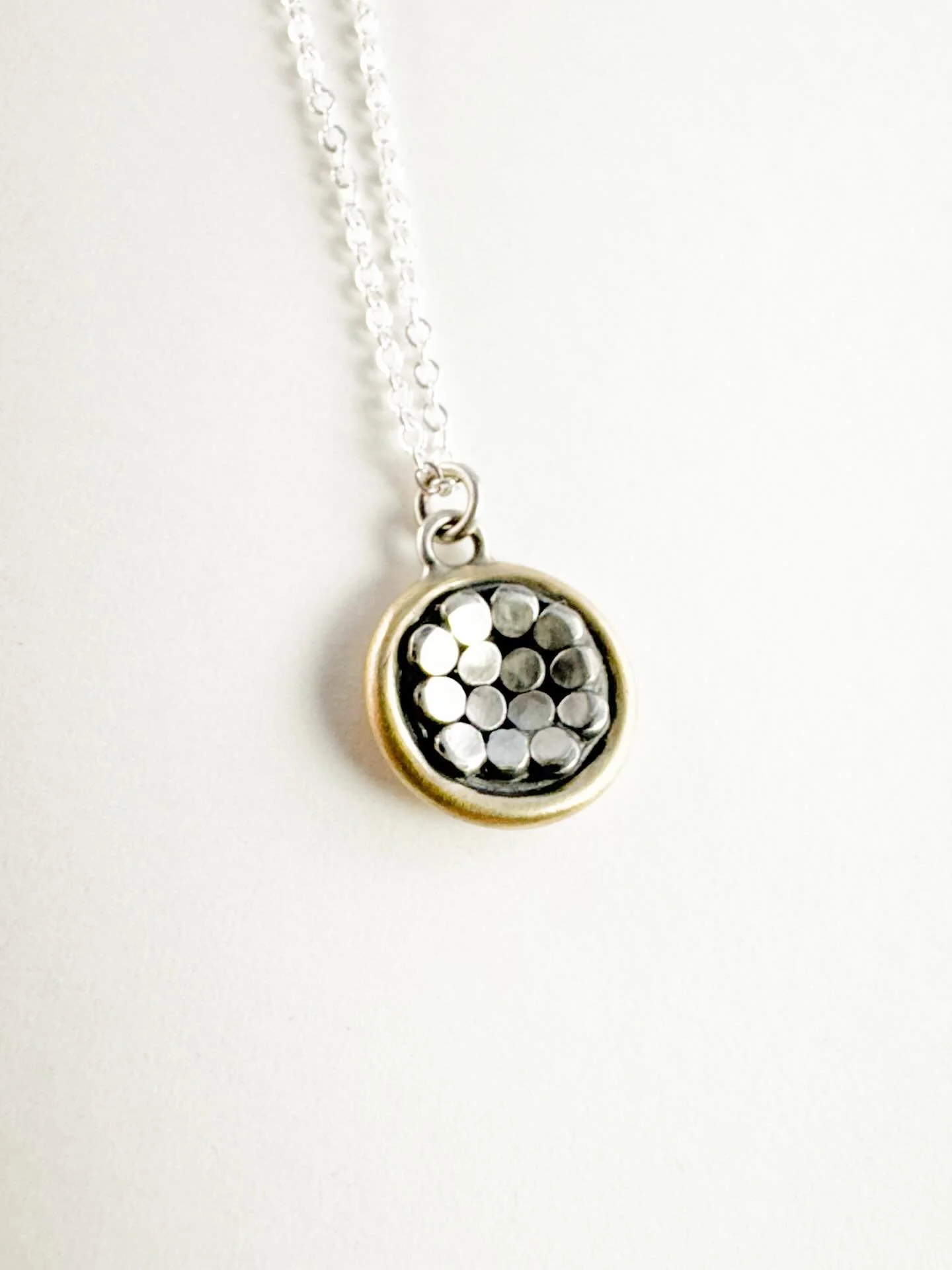 Little One Necklace. Charming little pendant on an 18&rdquo; sterling chain. 

I enjoyed making this one. Technically not granulation (I think that&rsquo;s fine silver on sterling eh?), but the sterling balls I soldered onto the disc. To tightened th