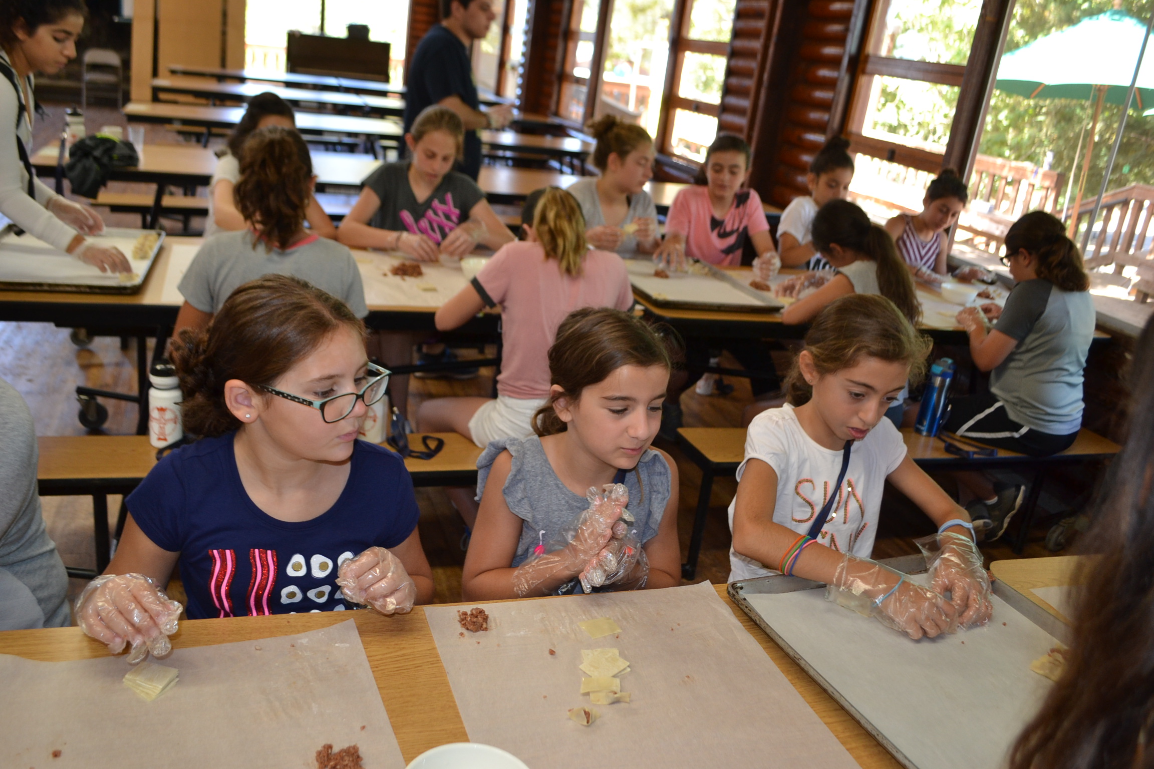 Campers learning how to make mante!