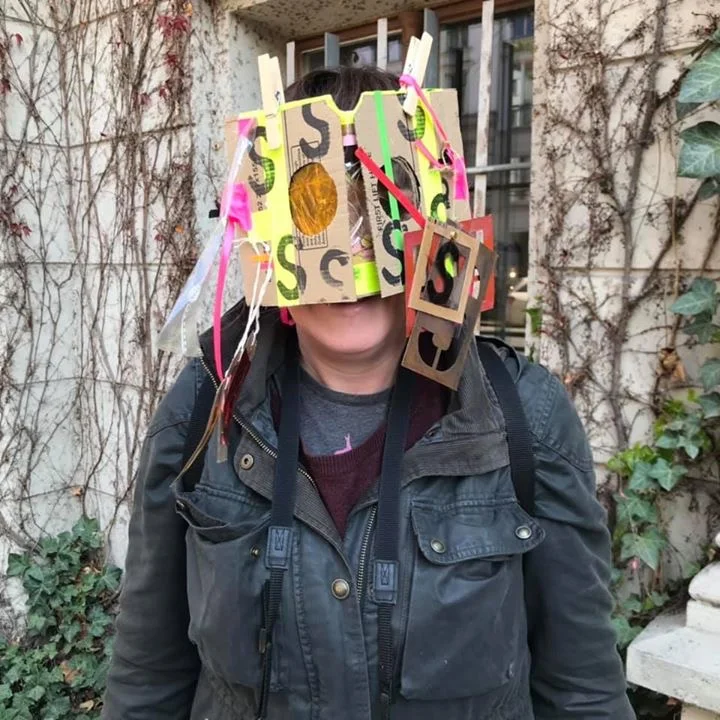 Person with self-made wearable art viewfinder
