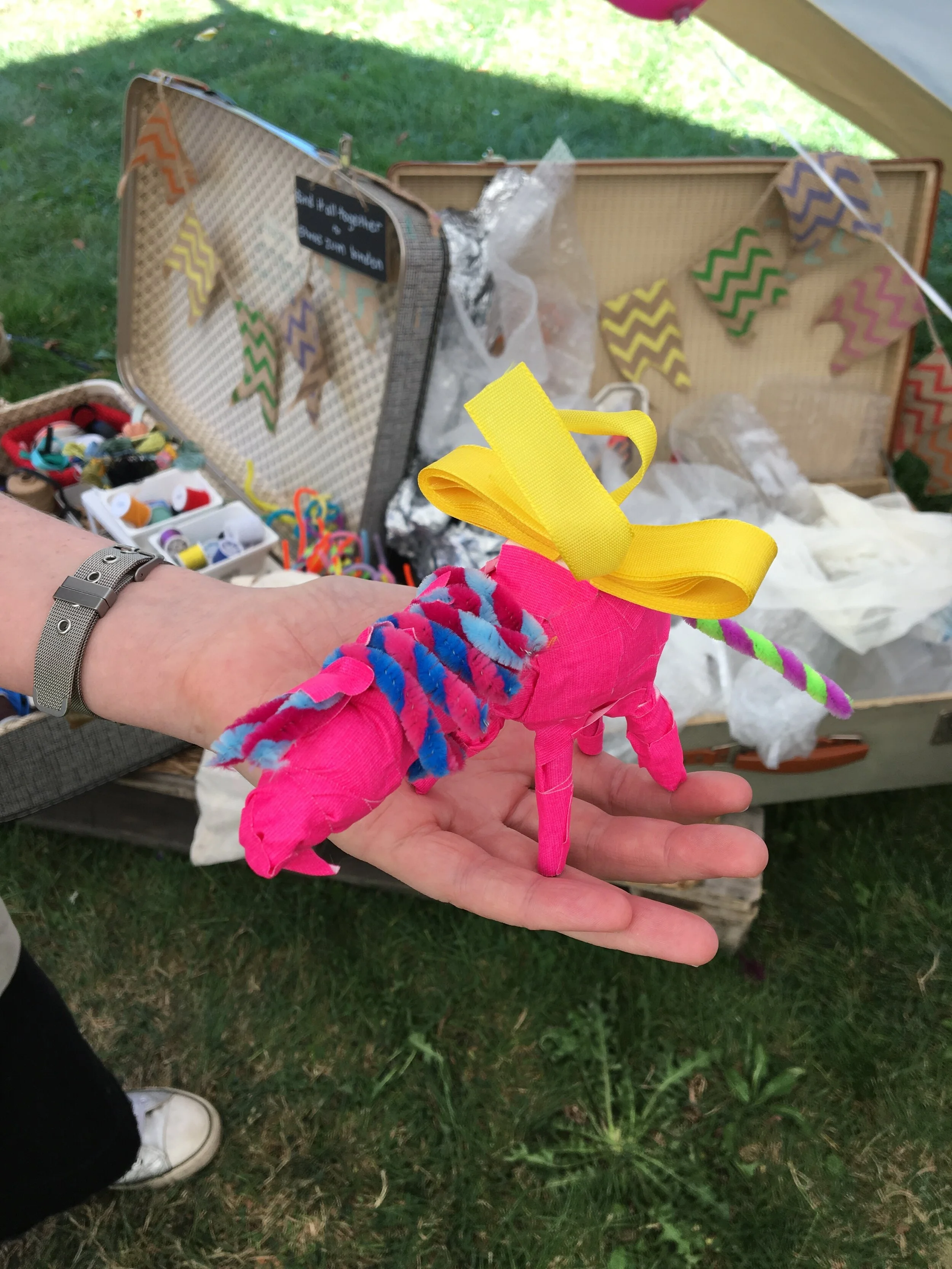 Creature made of upcycled junk with vintage craft suitcases