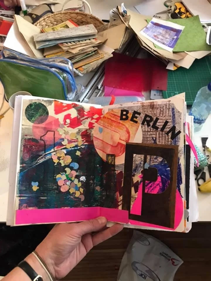 Berlin sketchbook pages opened showing graphic collage