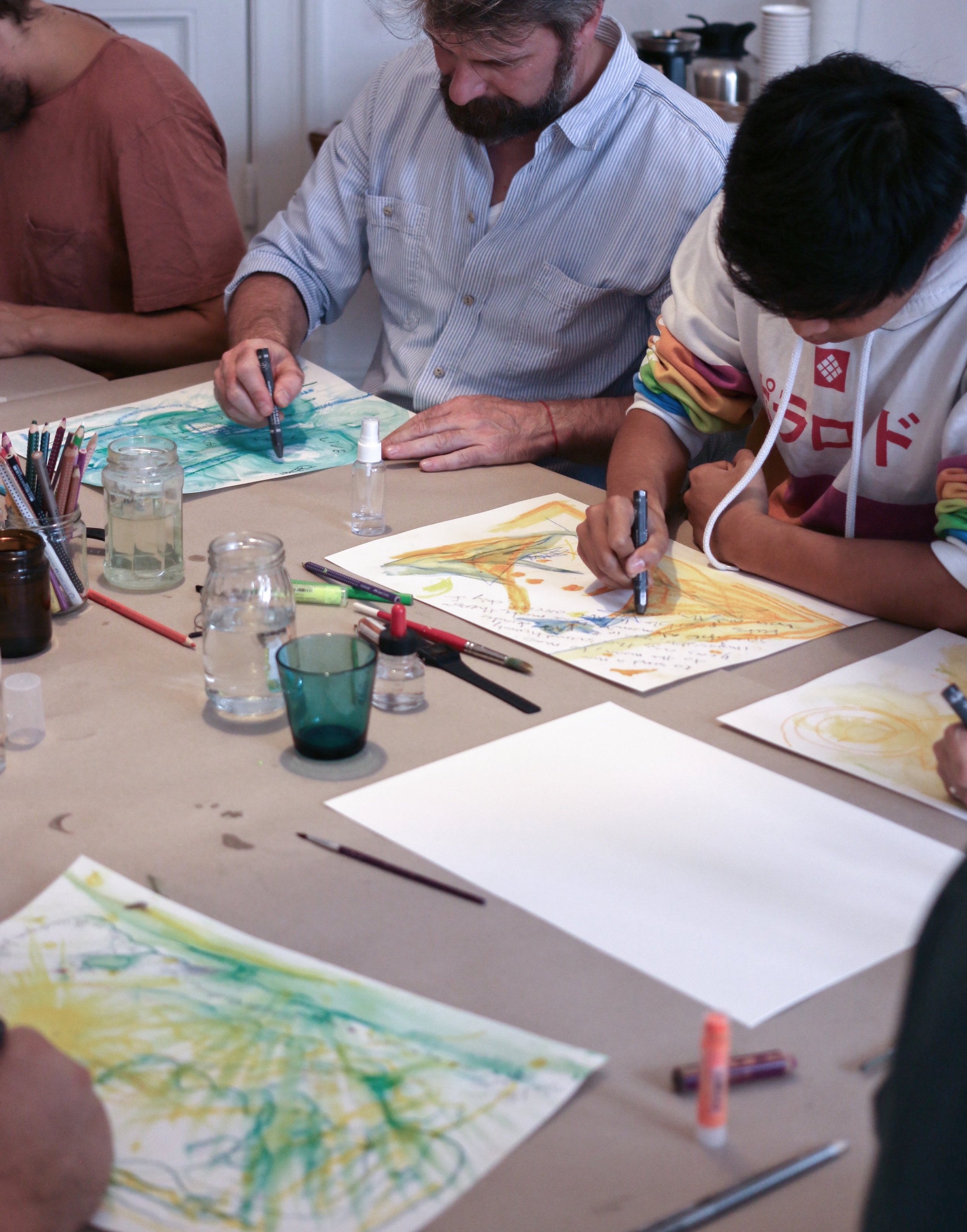 Men drawing, doodling letting go of stress