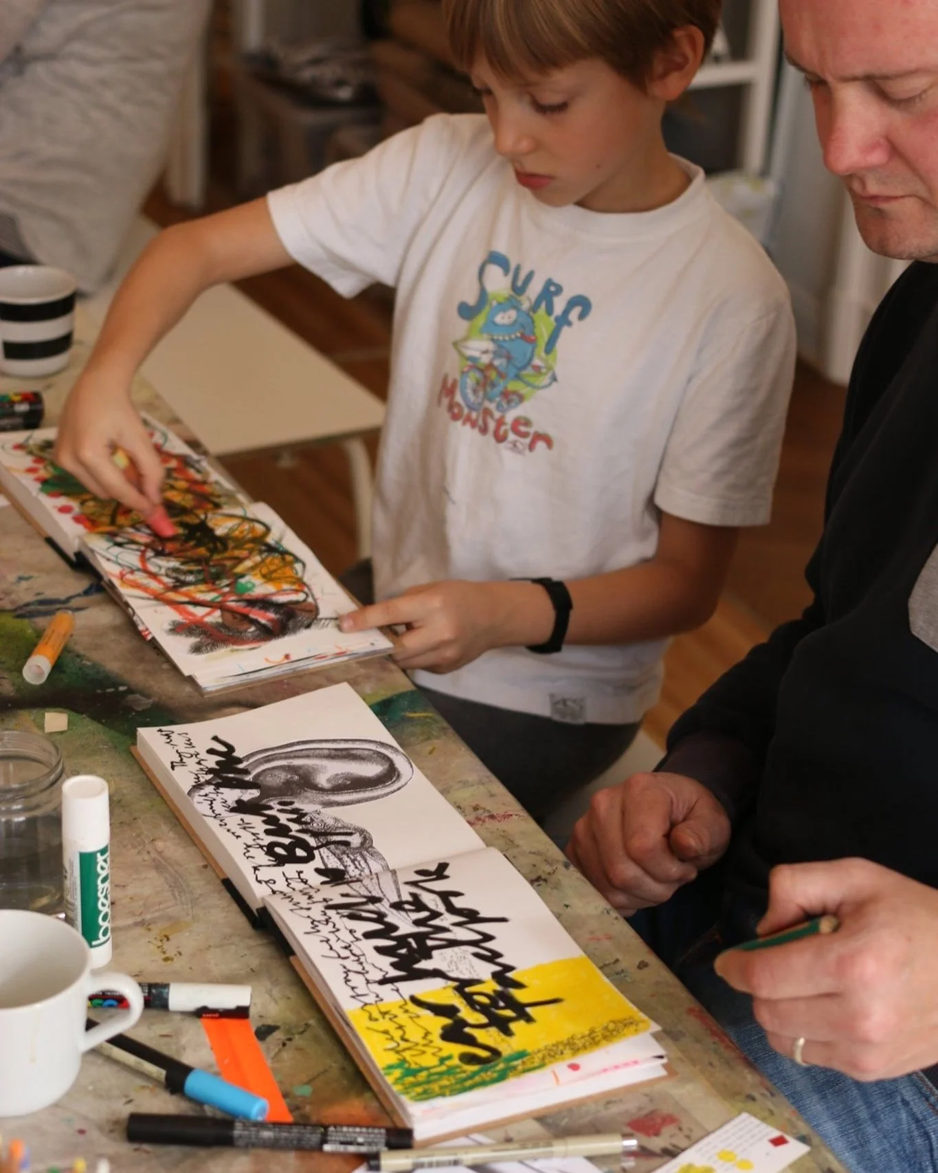 Child doodling for relaxation in a journal