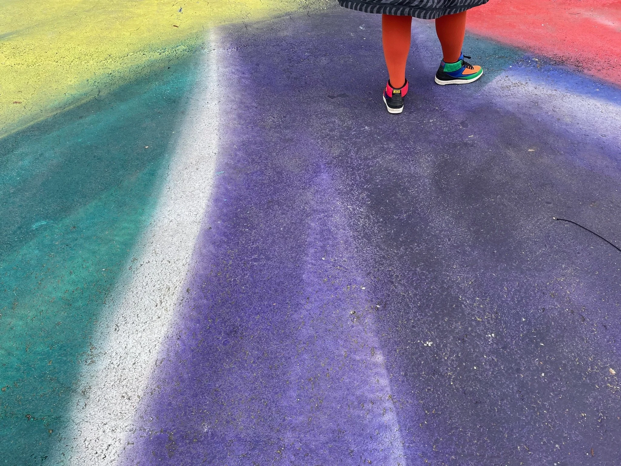 colourful feet moving forwards standing in an art work