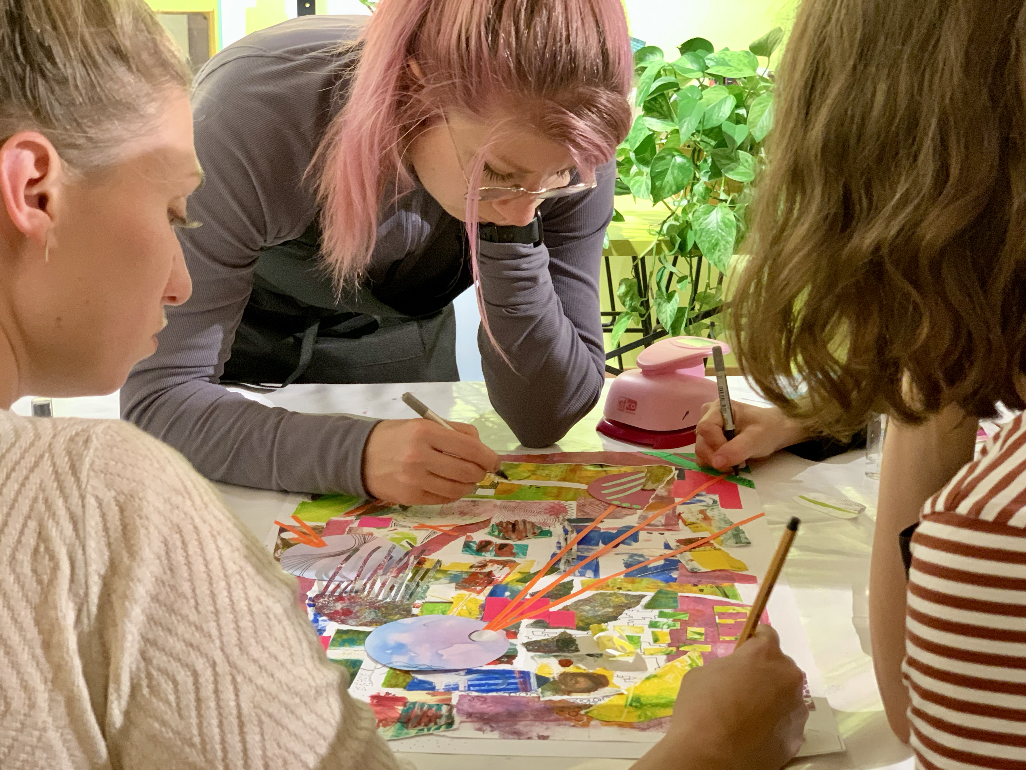 Team connecting through drawing, doodling, collaging art