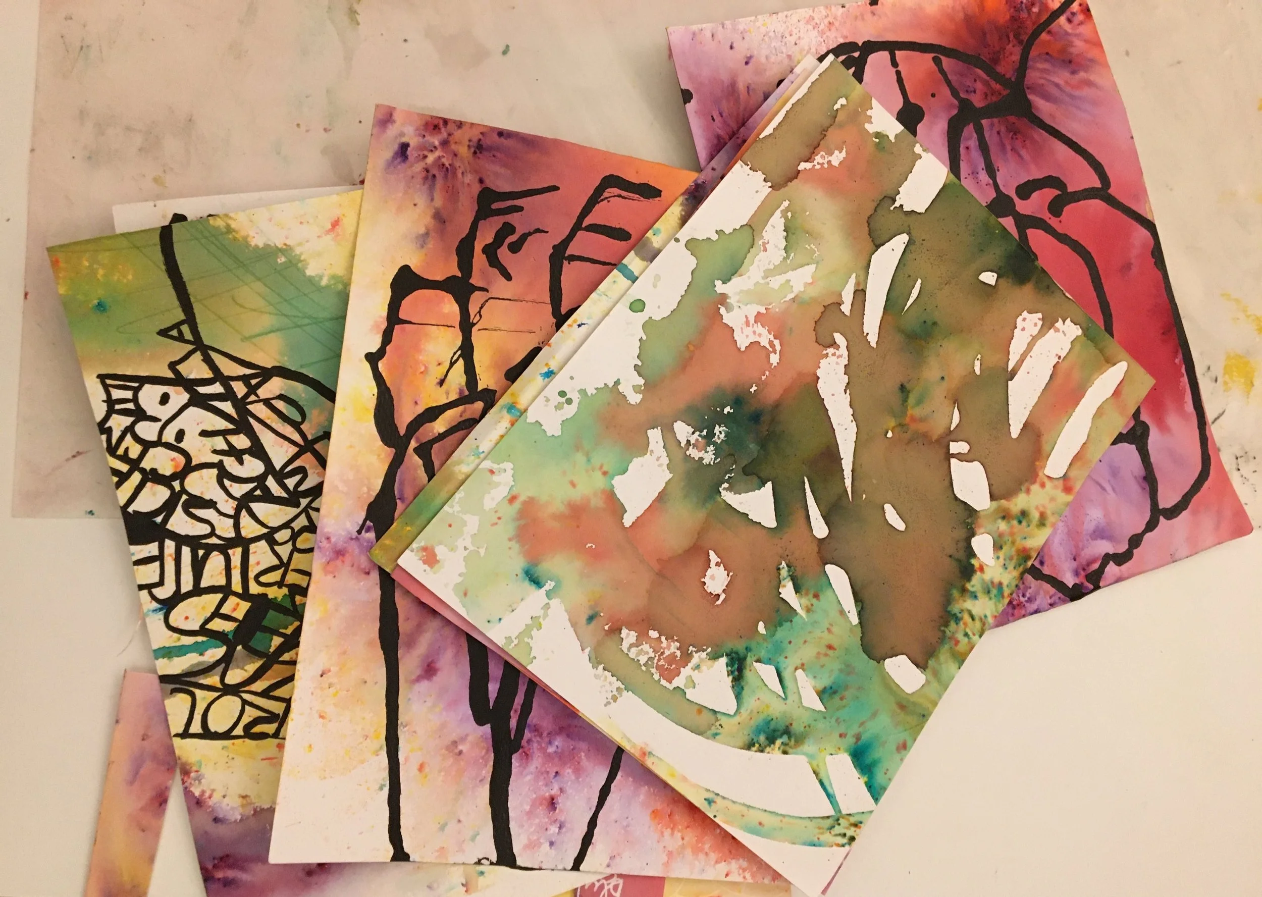 Pages of expressive, abstract watercolour art made during an art workshop
