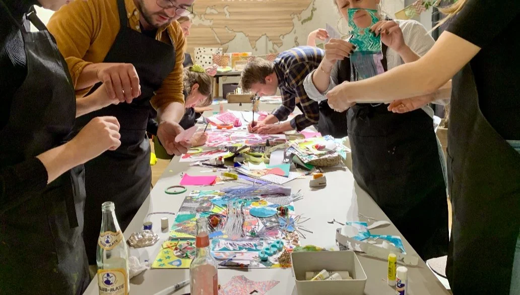 Team having fun making graphic collage art together