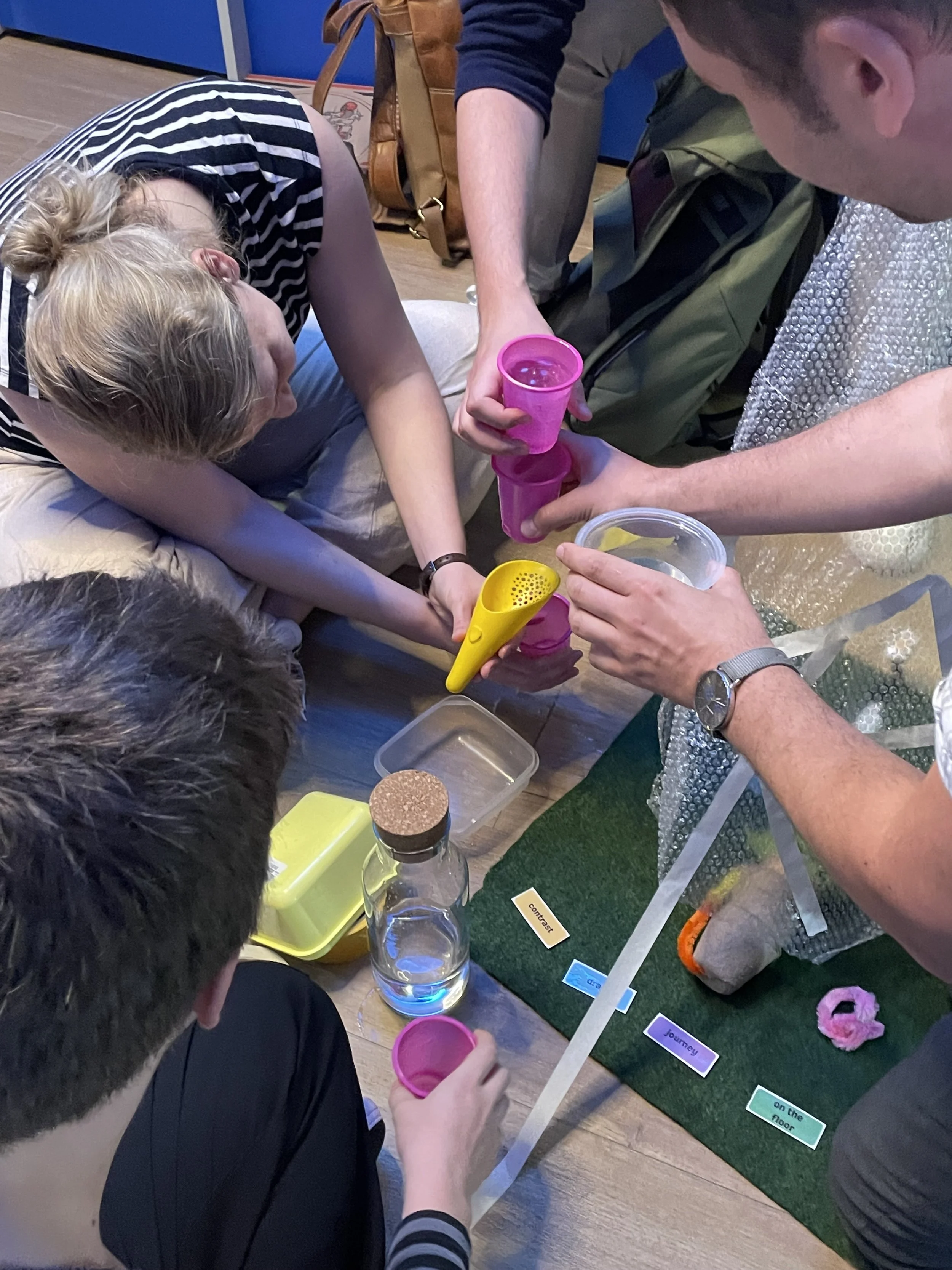 Team connecting with using prompts and junk to make art