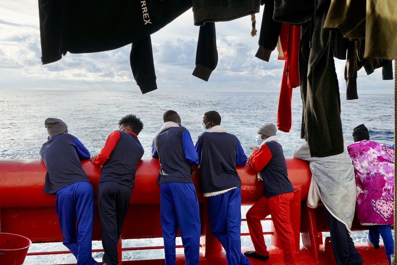 Survivors are looking at the sea onboard Ocean Viking.