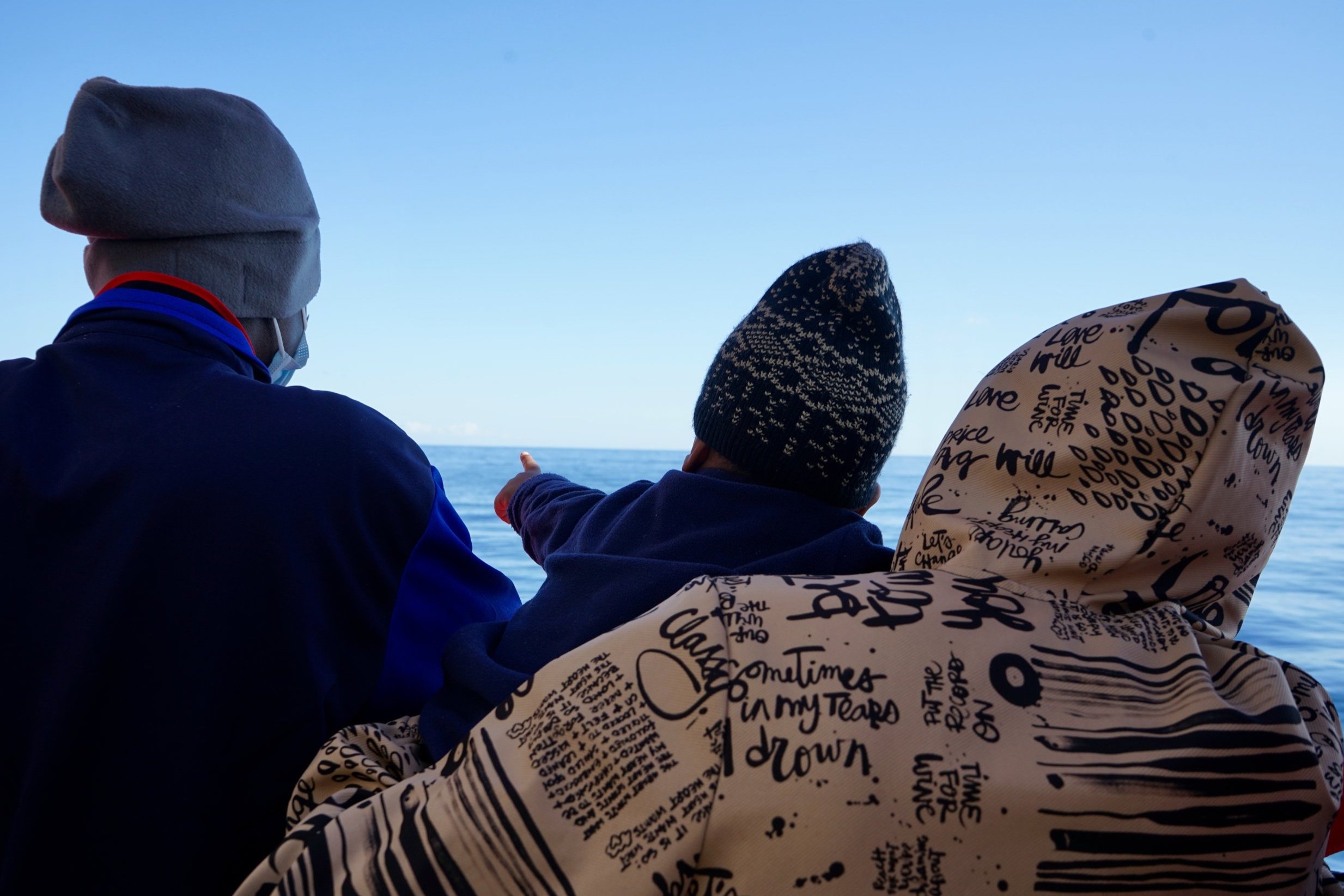 Survivors on board Ocean Viking looking out on the horizon.