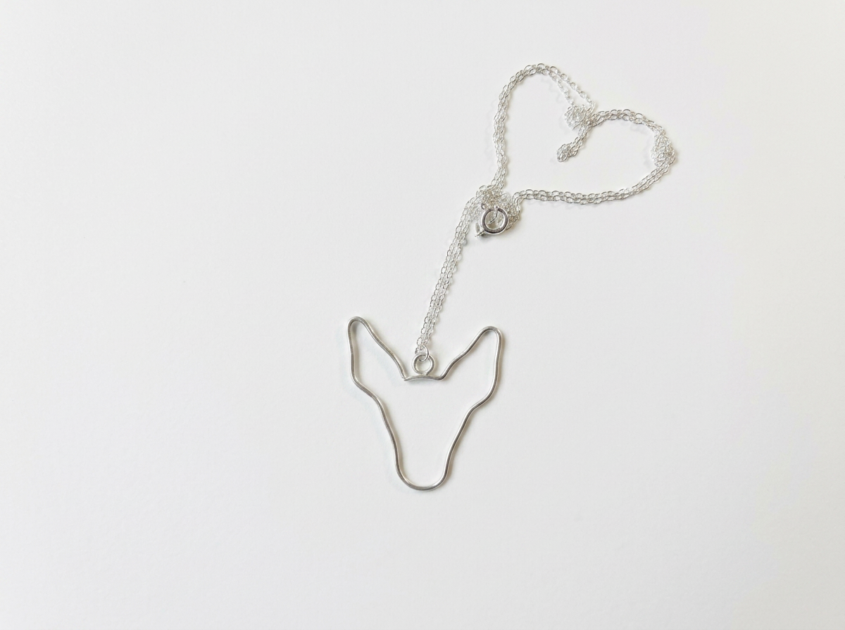 Custom handcrafted recycled sterling silver dog silhouette pendant with brushed satin finish.