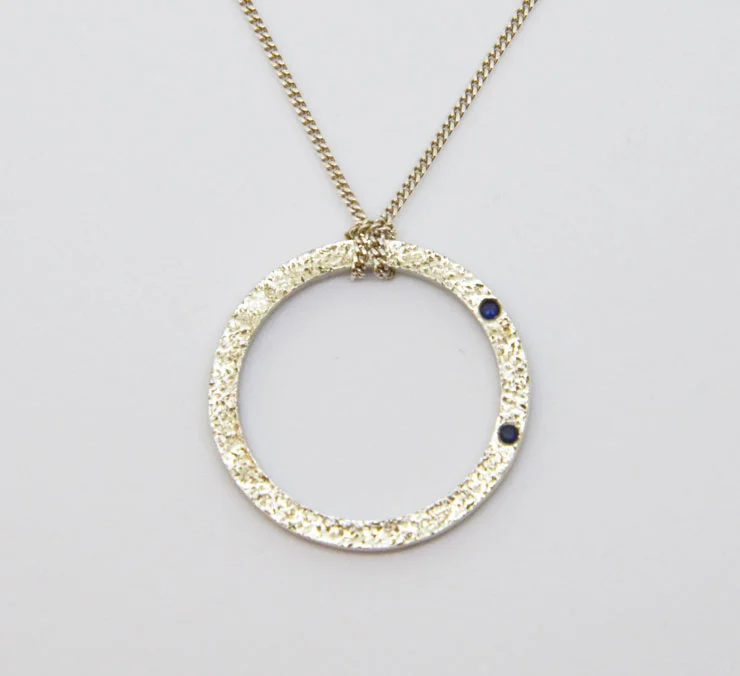 Silver and sapphire circle pendant