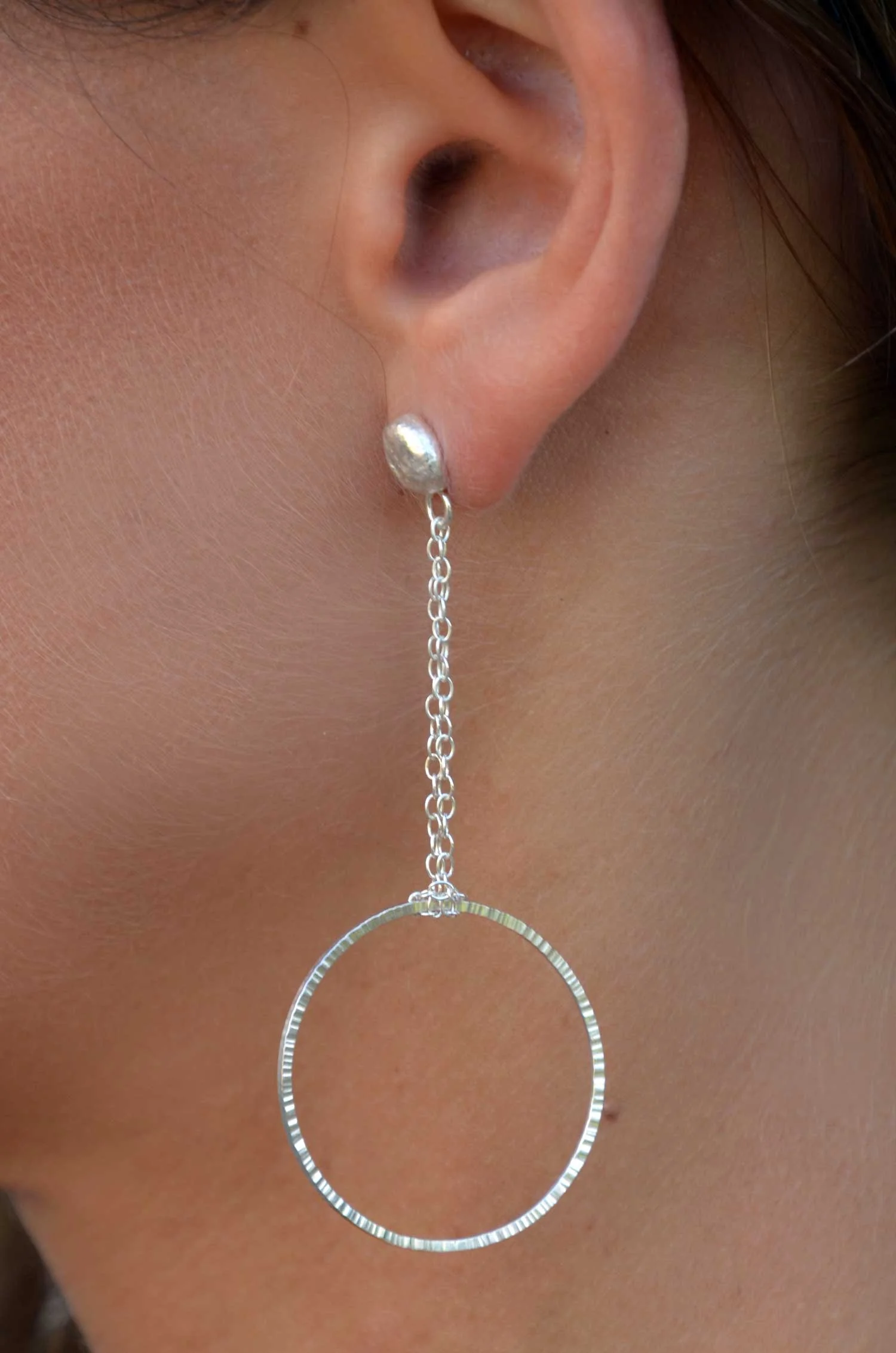 handmade hammered circle earring on model victoria grace