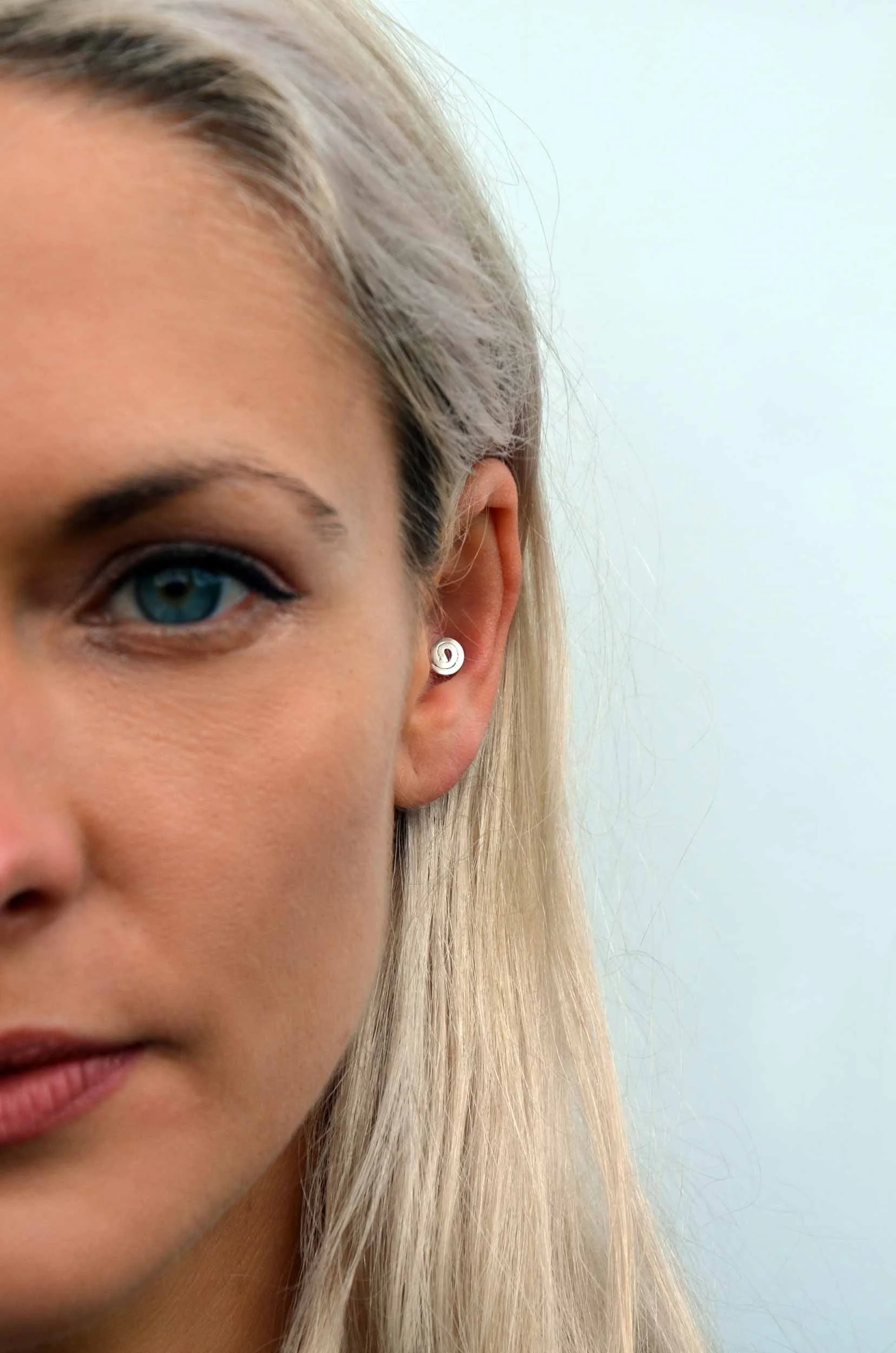 Silver conch piercing on model victoria grace silversmith